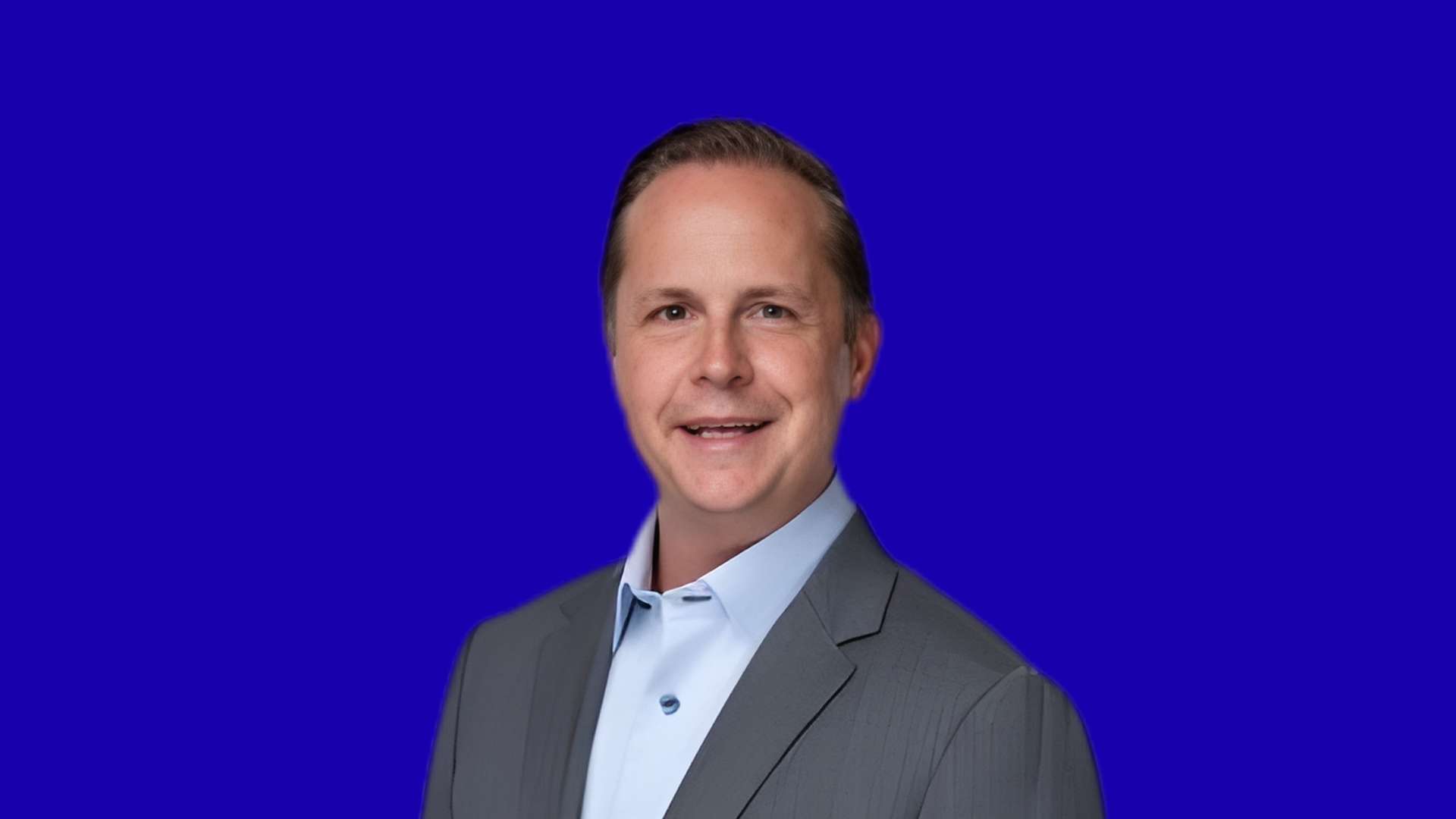 Scott Schneider in blue background